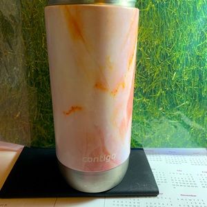 Orange 🍊 and cream colored hot cup 🥤